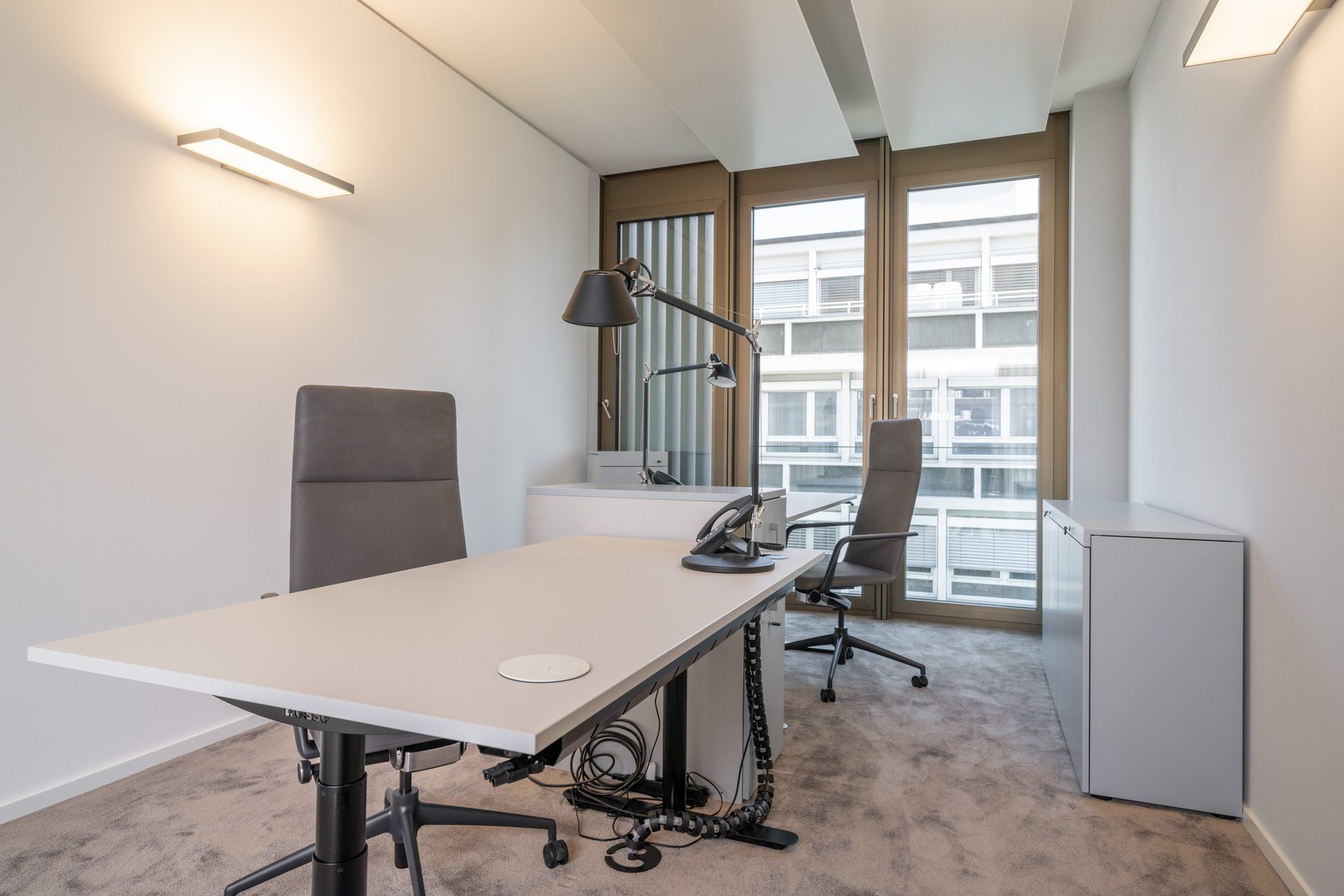 Private office with a desk by the window